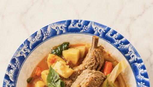 Curry with potato and braised meat in a blue-and-white bowl